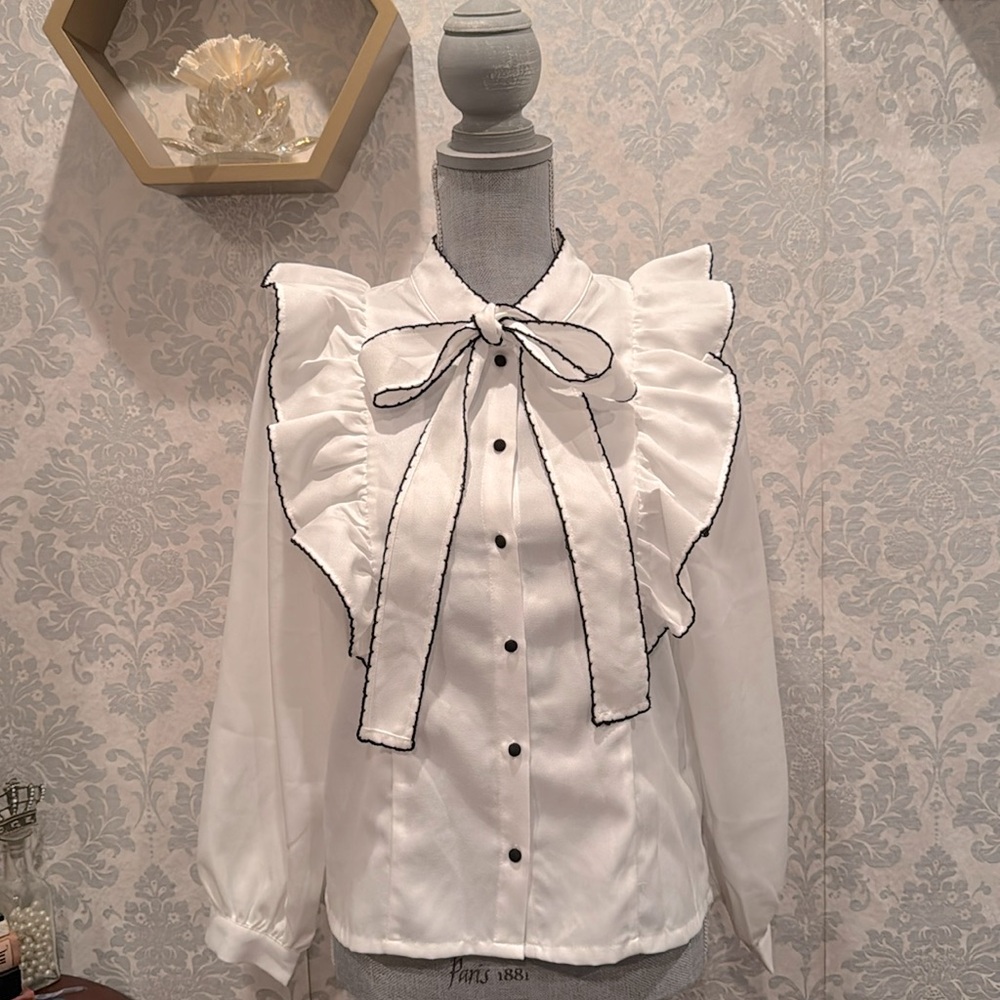 White blouse with bow and ruffles
